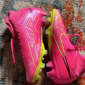 Pink Nike cleats, used with some scuffs, originally bought for $150 CA